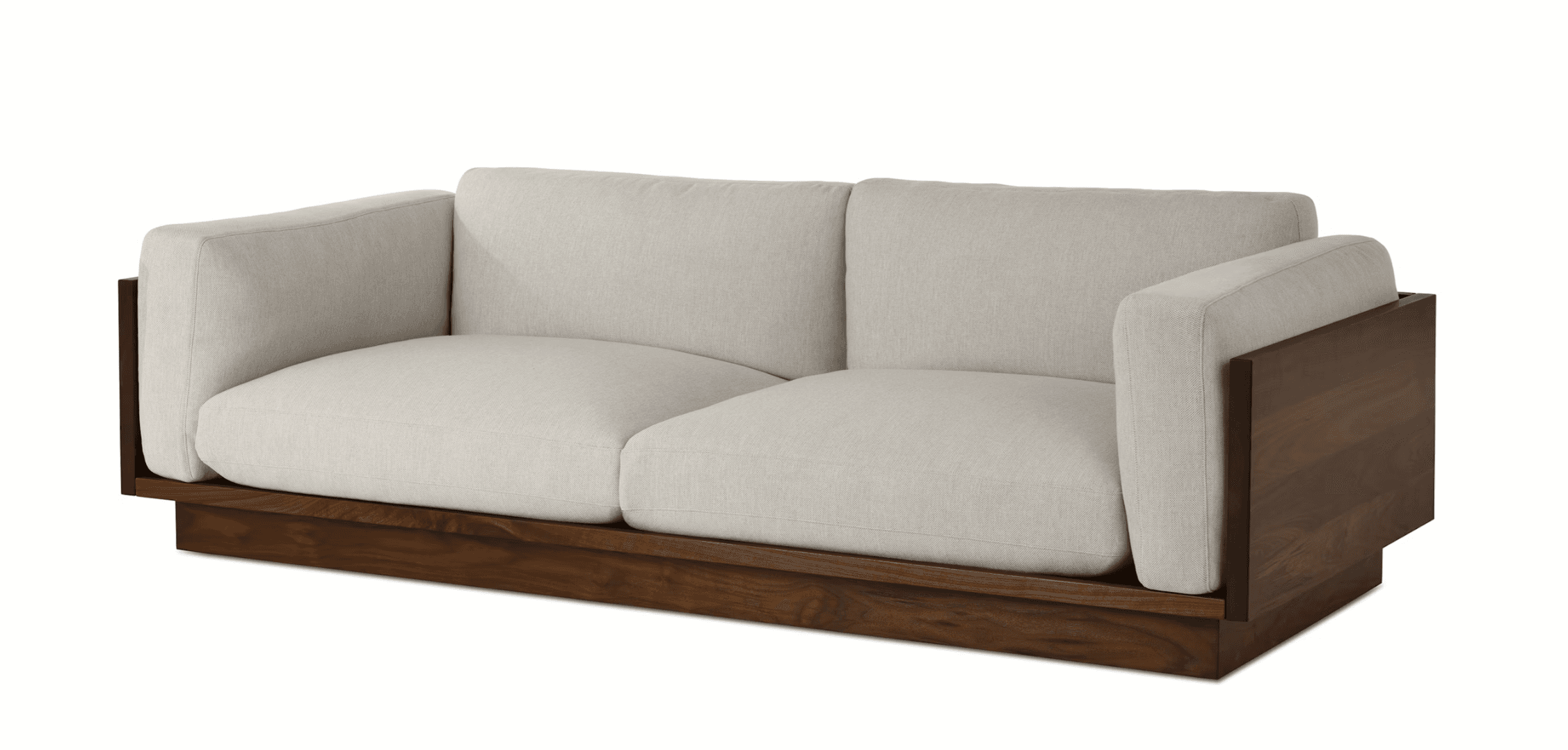 A modern sofa with a low-profile wooden base and frame. The seating and back cushions are upholstered in a light-colored fabric. The armrests are integrated into the wooden frame, creating a distinct geometric shape on the sides. — 3D model