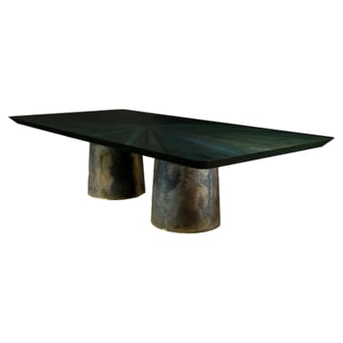 A rectangular dining table featuring a dark, multi-tonal radial pattern on its tabletop and supported by two large, cylindrical bases with a heavily textured, patinated finish. — 3D model