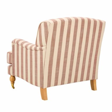 A striped armchair with a loose cushion and ornate wooden legs with casters. The armchair features a curved backrest and rolled arms, upholstered in fabric with a vertical stripe pattern in beige and muted red. A rectangular throw pillow with a similar stripe pattern is placed on the seat. — 3D model
