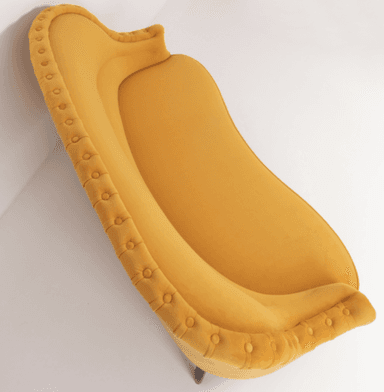 A traditional style armchair upholstered in a rich yellow velvet fabric. The chair features distinct rolled arms and a rolled crest rail on the backrest. It has four wooden legs, with a visibly turned leg at the front and a tapered leg at the rear. — 3D model