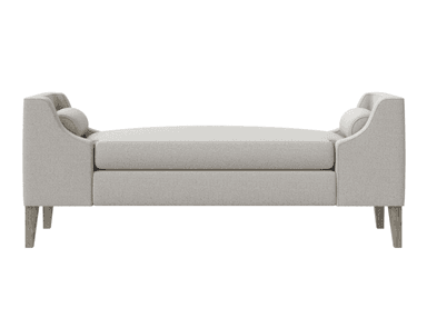 A light-colored, upholstered chaise lounge with a rolled armrest on one end and a sloped backrest on the other. It features four tapered wooden legs and a bolster pillow at the rolled armrest end. The upholstery appears to be a textured fabric. — 3D model