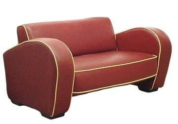 A vintage-style loveseat or small sofa, upholstered in a deep red material. It features rounded armrests and a streamlined silhouette, accentuated by contrasting yellow piping along the edges of the cushions and armrests. The base appears to be low and integrated into the design. — 3D model