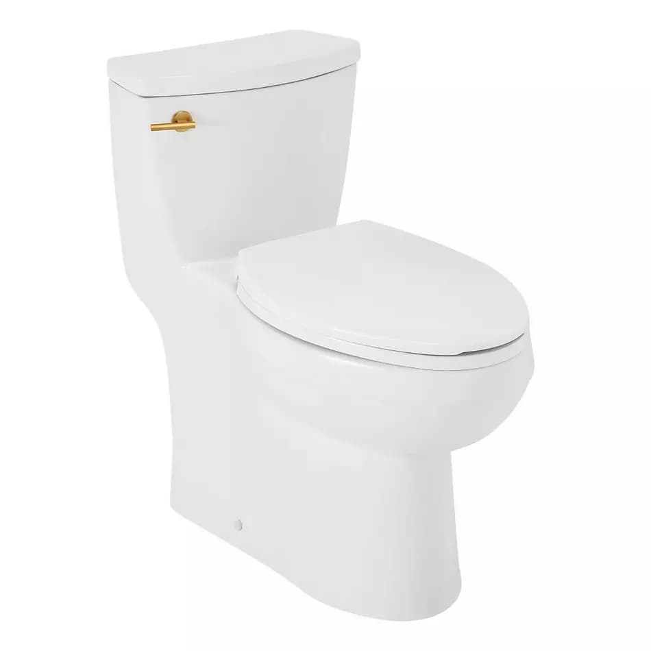 A modern, one-piece toilet with a smooth, rounded design. The tank and bowl are integrated into a single unit. It features a white ceramic construction and a gold-toned flush lever on the left side of the tank. The toilet seat is also white and has a standard shape. A small circular indicator is visible near the base of the toilet. — 3D model