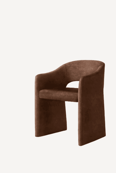 A contemporary armchair featuring a distinctive sculptural form, fully upholstered in a brown suede-like fabric. The chair has a U-shaped backrest that seamlessly transitions into integrated armrests. The base is also fully upholstered, giving it a solid, grounded appearance without visible legs. An open cut-out is present between the seat and the lower backrest. — 3D model