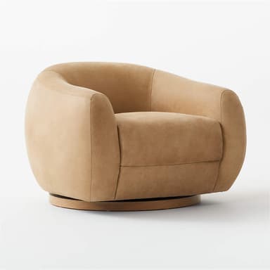 A contemporary armchair with a rounded, barrel-shaped silhouette. It features a low-profile design with generously padded upholstery and a swivel base. The base is a circular wooden platform, likely designed for 360-degree rotation. The overall form is soft and inviting, with seamless upholstery transitions. — 3D model