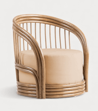 A barrel-shaped armchair constructed primarily from bentwood or cane, featuring a rounded backrest formed by vertical spindles connected to a top and bottom circular frame. The seat and lower body are upholstered in a light tan fabric. The base has subtle feet or glides. — 3D model