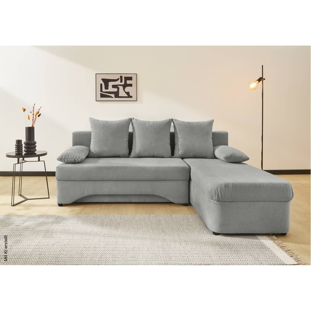 An L-shaped sectional sofa upholstered in light grey fabric, featuring a main sofa section and a connected chaise lounge. It includes multiple loose back cushions and a detached armrest cushion, suggesting a modern, functional design with potential for convertibility or storage. — 3D model