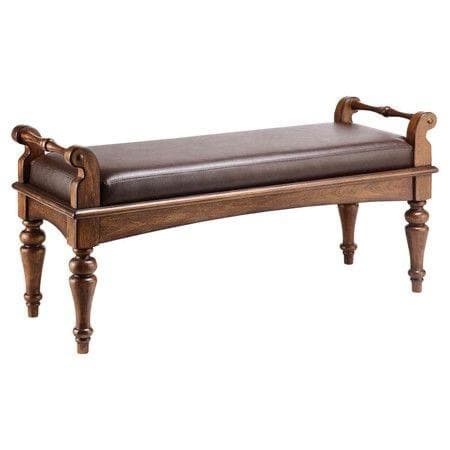 A traditional style bench featuring a sturdy dark wood frame with ornate turned legs and scrolled armrest-like elements at either end. The rectangular seat is upholstered in a dark brown, possibly leather or faux leather, material with visible stitching. The overall design suggests a classic aesthetic suitable for various formal or traditional interior settings. — 3D model