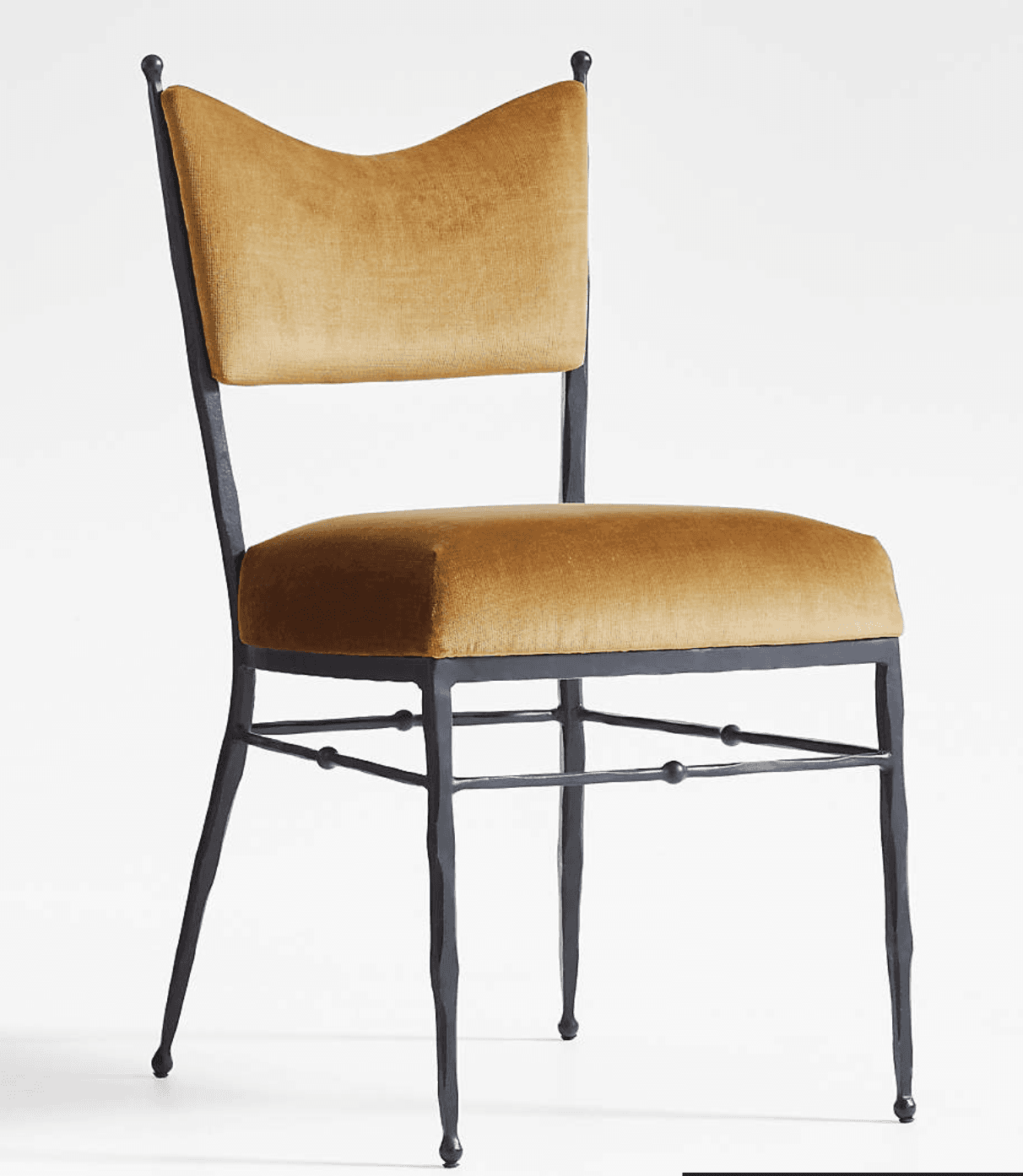 An upholstered dining chair with a dark-finished forged iron frame and gold velvet upholstery, featuring a distinctive scalloped backrest. — 3D model