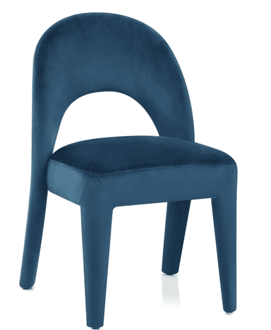 A side profile view of an accent chair upholstered in a teal-colored velvet fabric. The chair features a high, curved backrest that extends down to form the armrests. The seat is well-padded and rectangular. The chair stands on four tapered legs, with the front legs extending from the seat structure and the rear legs integrated into the backrest's curve. The upholstery shows subtle stitching details, and the overall form is modern and elegant. — 3D model