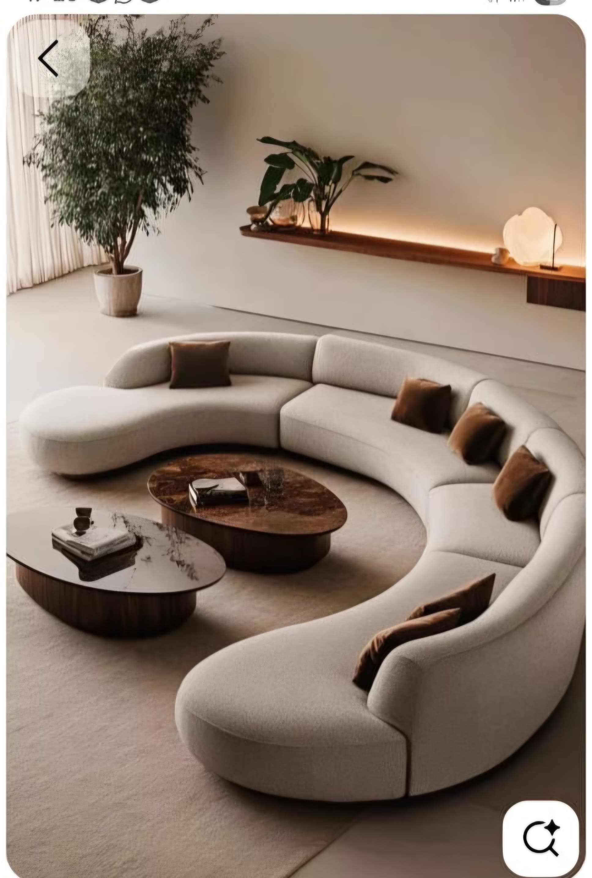 A large, contemporary curved modular sectional sofa upholstered in a light beige, textured fabric, featuring multiple individual sections that combine to form a crescent or C-shaped seating arrangement. The sofa is accessorized with several dark brown square and rectangular throw pillows. — 3D model