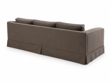 A three-seater sofa upholstered in a neutral taupe fabric, featuring three seat cushions, three back cushions, and wide square arms. The sofa includes a pleated skirted base and light-colored piping detail along all cushion and arm edges. — 3D model