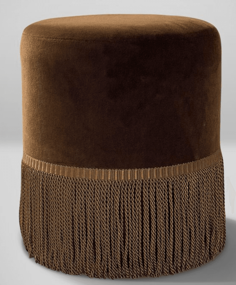 A cylindrical upholstered stool featuring plush brown velvet upholstery and a decorative fringe around its base. — 3D model