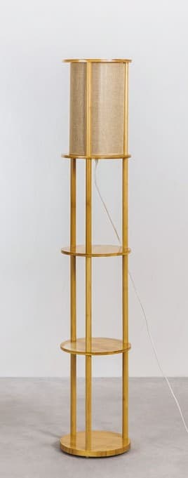 A tall, modern floor lamp featuring a light-toned wooden frame and a cylindrical fabric lampshade. The lamp incorporates three circular wooden shelves below the light source, providing integrated storage or display space. The design is minimalist and vertical. — 3D model