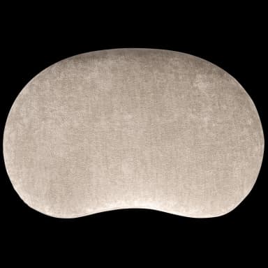 The image displays a single, kidney-bean shaped floor cushion. It is fully upholstered in a light beige or taupe plush, textured fabric, likely velvet or chenille. The edges are soft and rounded, indicating a padded construction. The object is presented against a black background, highlighting its organic form and soft appearance. — 3D model