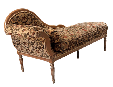 A traditional chaise lounge featuring an ornate carved wooden frame and rich floral tapestry upholstery, designed for comfortable reclining. — 3D model
