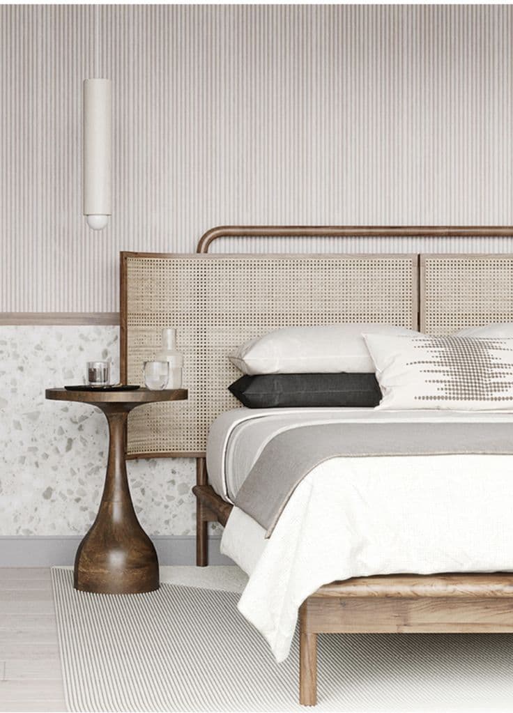 A small, contemporary side table featuring a circular wooden top with a woven cane inlay, supported by a single flared pedestal base made of light-toned wood. — 3D model