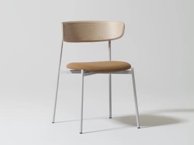 A modern dining chair with a bentwood backrest and a fabric-upholstered seat, supported by a slender, light gray metal frame. The backrest exhibits a natural wood grain pattern and a curved silhouette. The seat is padded and covered in a textured, tan-colored fabric. The frame consists of four thin, cylindrical legs connected by a horizontal support structure under the seat, all finished in a matte light gray. — 3D model