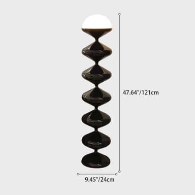 A tall, modern floor lamp featuring a sculptural base composed of six stacked, bulbous, glossy black segments, tapering towards the top. It is crowned with a luminous, hemispherical light diffuser, emitting a warm glow. — 3D model