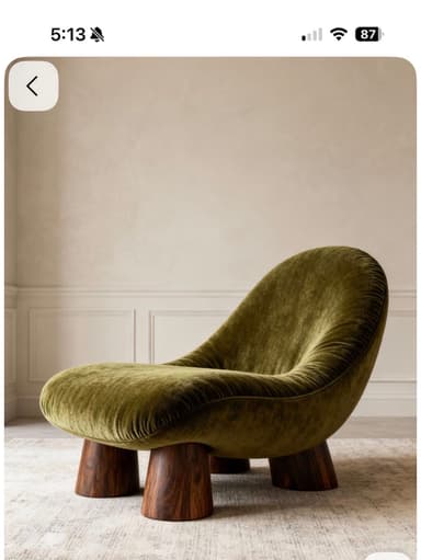 A low-profile, organically shaped lounge chair upholstered in plush olive green velvet, featuring a continuous, gently curved seat and backrest. It is supported by three short, stout, conical dark wood legs. — 3D model