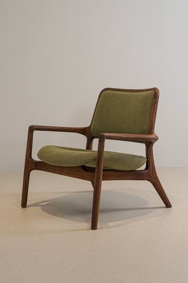 A modern accent chair with a wooden frame and upholstered seat and backrest. The frame has a distinctive curved shape, and the upholstery is a textured green fabric. — 3D model