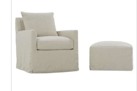 An upholstered armchair featuring a full, floor-length skirted base and a neutral-toned fabric. It has a loose back cushion and a removable seat cushion. — 3D model
