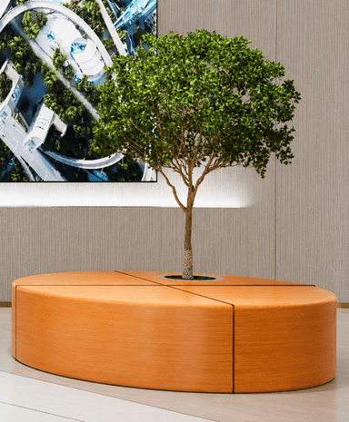 A modern circular bench made of light-colored wood, designed to surround a tree or planter. The bench is segmented into four equal parts with a central circular opening featuring a polished metal ring around the base of a small tree. — 3D model