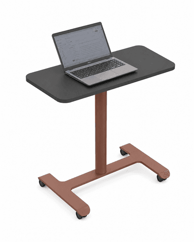 A modern mobile side table featuring a rectangular dark gray tabletop with rounded corners, supported by a single cylindrical pedestal. The pedestal connects to a rust-colored, powder-coated metal C-shaped base that is equipped with four black caster wheels for mobility. — 3D model