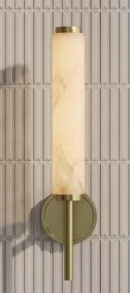 A modern wall sconce featuring a cylindrical alabaster shade mounted on a brushed brass fixture. The light diffuses through the translucent alabaster, revealing natural veining, and is supported by a slender brass arm extending from a circular wall plate. — 3D model