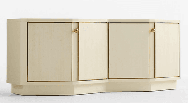 A long, low sideboard cabinet featuring a cream-colored lacquered finish and brass hardware. The facade is subtly segmented with four cabinet doors, each framed by brass trim. The cabinet sits on a recessed plinth base that follows the slight inward curve of the segmented front, giving it a distinctive postmodern appearance. — 3D model