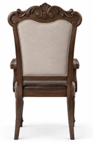 A single traditional dining armchair featuring a dark-stained carved wooden frame, a button-tufted light-colored fabric backrest, and a brown distressed leather seat with decorative nailhead trim. The chair exhibits ornate detailing on the crest rail, scrolled arms, and turned front legs. — 3D model