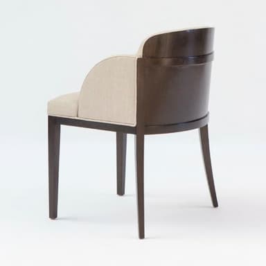 An elegant armchair featuring full beige linen-blend upholstery on the seat, backrest, and integrated armrests. The chair has a sturdy dark-stained wood frame that forms the legs and is partially exposed along the backrest. The legs are straight and tapered, complementing the contemporary design. — 3D model