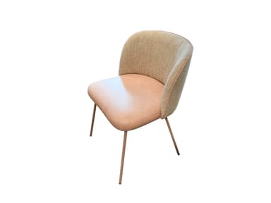A view from the back of an upholstered armchair with a curved backrest. The chair has thin, tapered metal legs and is trimmed with a thin piping detail along the top edge of the backrest. — 3D model