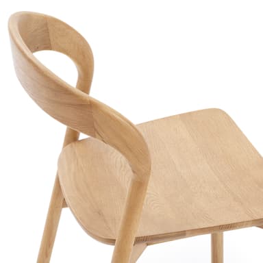 A light-toned solid wood chair, likely oak or ash, featuring a minimalist design with a smoothly curved backrest and a subtly contoured seat. It has four straight, round legs connected by stretchers, and no armrests. — 3D model