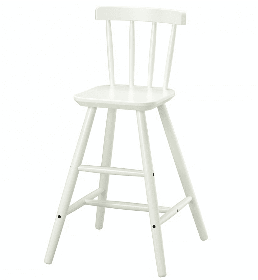 A white wooden high chair featuring a classic spindle backrest, a solid square seat, and splayed legs reinforced with multiple footrests. The chair is entirely finished in a uniform white color, highlighting its clean and simple design. — 3D model