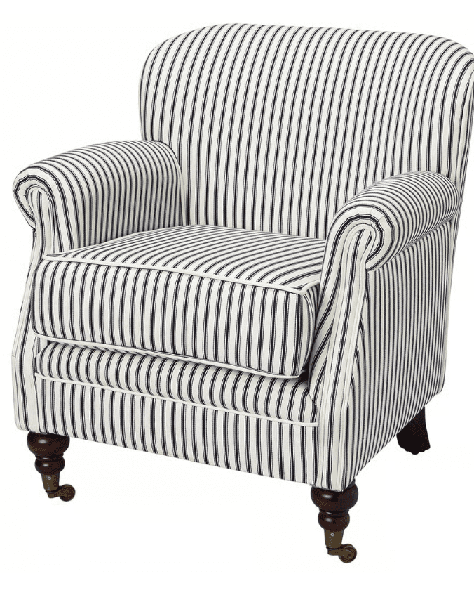 A classic upholstered armchair featuring a vertically striped white and navy blue fabric, rolled arms, and turned wooden legs with brass casters on the front. It has a loose seat cushion and a high, slightly curved back. — 3D model