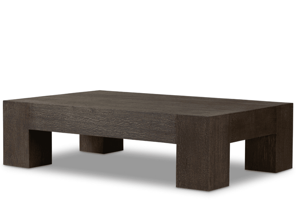A rectangular coffee table made of dark, textured wood, featuring a thick tabletop and solid, block-like legs that provide a grounded, monolithic appearance. — 3D model