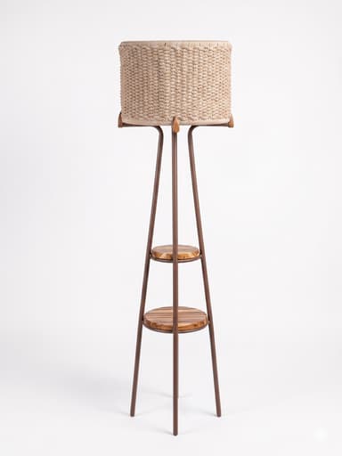 A floor lamp featuring a cylindrical shade made of woven rope-like material, set atop a slender dark metal frame that widens towards the base, incorporating two circular slatted wooden shelves. — 3D model