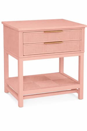 A contemporary blush pink nightstand featuring two drawers with reeded cane-style textured fronts, complemented by brass pulls, and an open bottom shelf with a matching textured surface, all supported by four straight legs. — 3D model