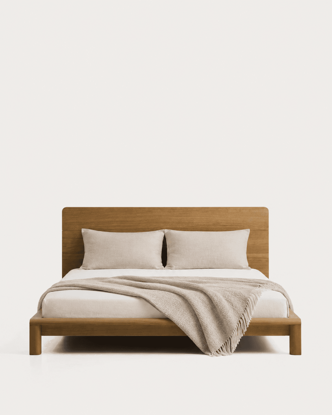 A modern solid wood platform bed featuring a minimalist design. The bed frame and integrated headboard are made of light-toned wood, supporting a mattress with two pillows and a beige throw blanket. — 3D model