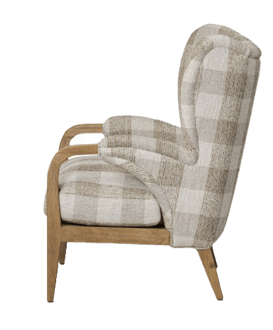 A contemporary wingback armchair featuring a high back with distinctive side wings, upholstered in a light-toned plaid fabric. The chair has an exposed wooden frame with gracefully curved armrests and tapered legs. The upholstery pattern consists of beige, light brown, and off-white squares, creating a warm and inviting appearance. The wooden elements appear to be light-colored oak or a similar wood, providing a natural contrast to the fabric. — 3D model