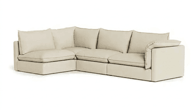 An L-shaped contemporary sectional sofa upholstered in a light beige fabric, featuring deep seats, plush loose back and seat cushions, and wide, low-profile track arms. The sofa is modular, composed of multiple connecting sections. — 3D model