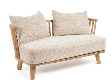 A two-seater sofa constructed with a light-colored wooden frame. The frame features slatted detailing along the base and turned spindle-style supports for the backrest. It is upholstered with a textured, light beige fabric on the seat and includes two matching throw pillows. — 3D model