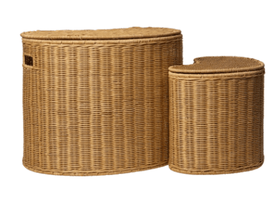 A light brown wicker laundry hamper with a distinct kidney-bean or curved oblong shape. The hamper features a tightly woven construction throughout its body and a matching, snugly fitted lid that echoes the curved form. Small, rectangular cutout handles are integrated into the short sides of the hamper, allowing for easy lifting and transport. The natural color of the wicker gives it an organic and casual aesthetic. — 3D model