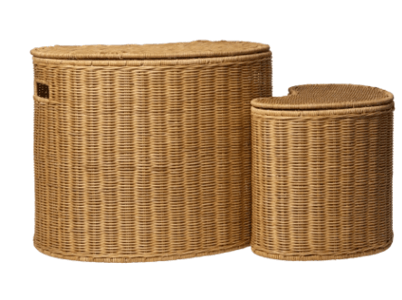 A light brown wicker laundry hamper with a distinct kidney-bean or curved oblong shape. The hamper features a tightly woven construction throughout its body and a matching, snugly fitted lid that echoes the curved form. Small, rectangular cutout handles are integrated into the short sides of the hamper, allowing for easy lifting and transport. The natural color of the wicker gives it an organic and casual aesthetic. — 3D model