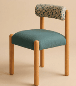 A contemporary accent chair featuring a unique cylindrical backrest upholstered in a patterned fabric, and a square seat upholstered in a solid teal fabric. The frame consists of four rounded, light-toned wooden dowel legs extending upwards to support the seat and backrest. The chair has a minimalist and playful aesthetic. — 3D model