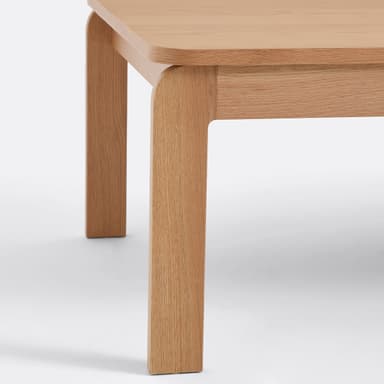 A rectangular coffee table with rounded corners and four straight legs. The table has a simple, minimalist design. — 3D model