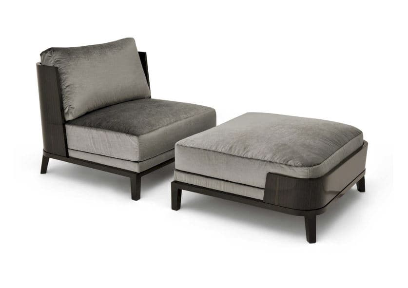 A modern armchair with a matching ottoman. The armchair features a plush, upholstered seat and backrest, with a high back cushion. The frame and armrests are constructed from dark, polished wood, possibly lacquered or stained. The ottoman is rectangular and upholstered to match the armchair, also with a dark wood base and detailing that echoes the armchair's design. The overall aesthetic is one of contemporary luxury. — 3D model