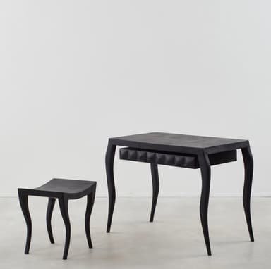 A black console table featuring a rectangular top, four curved cabriole legs, and a single drawer. The drawer front has a distinctive textured, possibly pyramidal or studded, surface. The entire piece is finished in a matte black. — 3D model