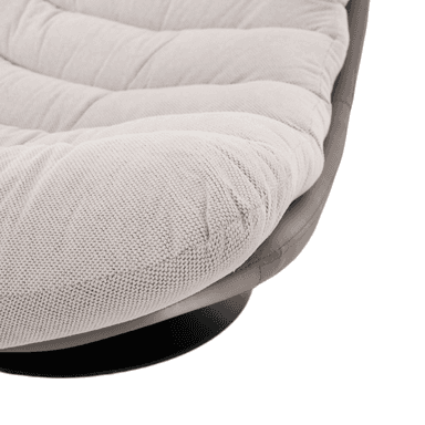 A modern accent chair with a swivel base. The chair features a low-profile, egg-shaped silhouette. The exterior shell appears to be made of a smooth, matte gray material, possibly faux leather or finished leather. The interior seating surface is upholstered in a textured, light-colored fabric with a subtle woven pattern and visible tufting. The chair rests on a circular, black metal swivel base. — 3D model